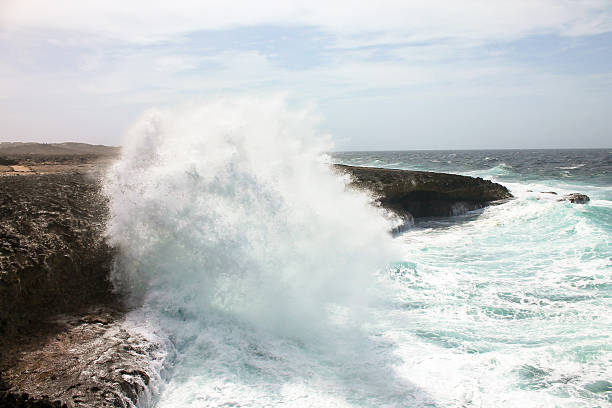 istock The force of the sea, pounding on the rocks, creating mist 2240626270