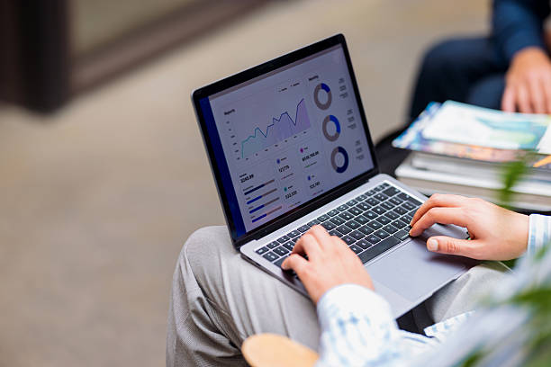 istock Business Analysis On Laptop With Data Charts And Graphs In A Modern Office Setting 2240629302