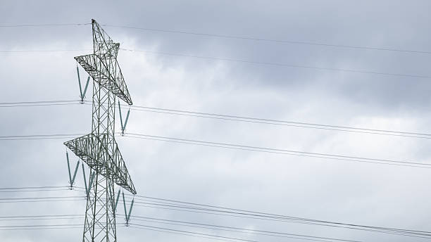 istock High voltage power line tower against cloudy sky 2240631061