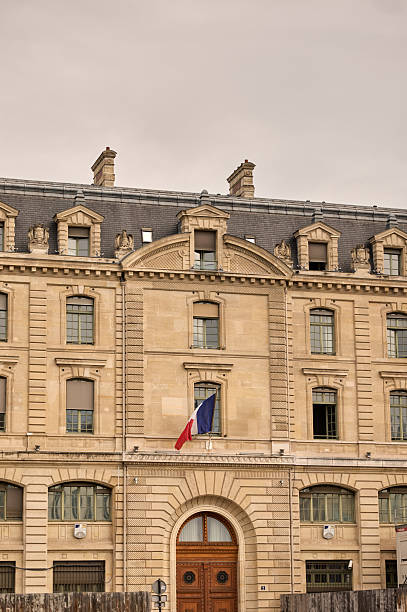 Elaborate architectural details of a classic european building with the national flag