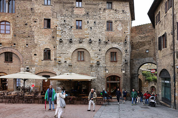San Gimignano, Italy - Sept 17, 2022: Piazza della Cisterna in San Gimignano, Tuscany, Italy