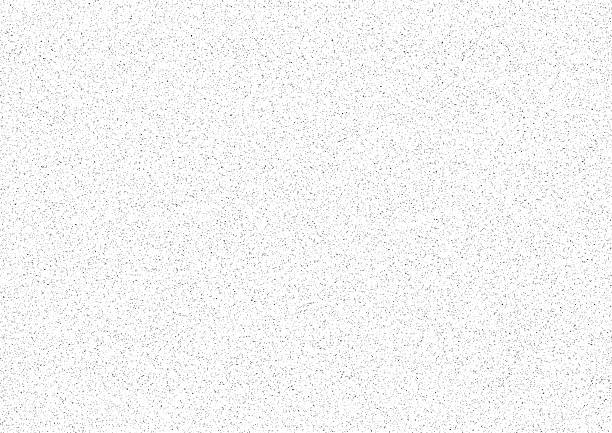 Seamless grainy grunge stippled black vector dots textured static noise pattern on white background