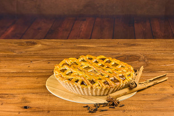 istock Apple pie in close-up on a rustic wooden background. 2240642709