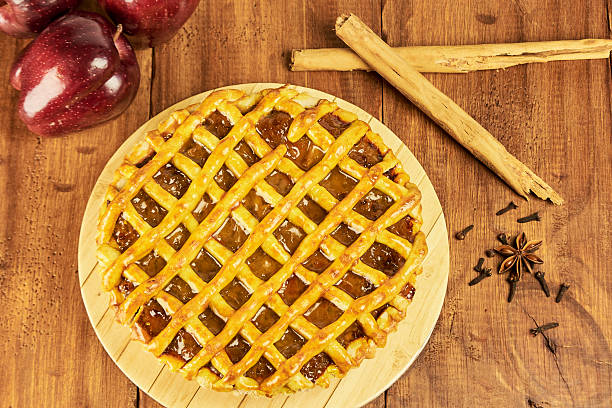 istock Apple pie in close-up on a rustic wooden background. 2240642712