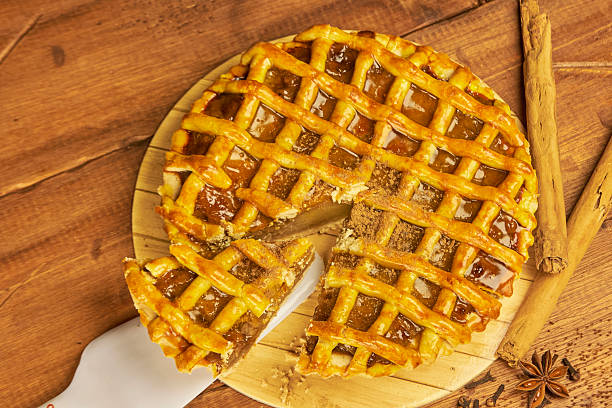 istock Apple pie in close-up on a rustic wooden background. 2240642727