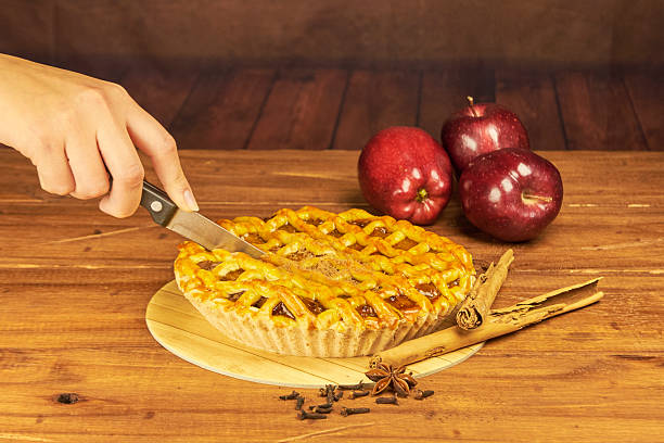 istock Apple pie in close-up on a rustic wooden background. 2240642728