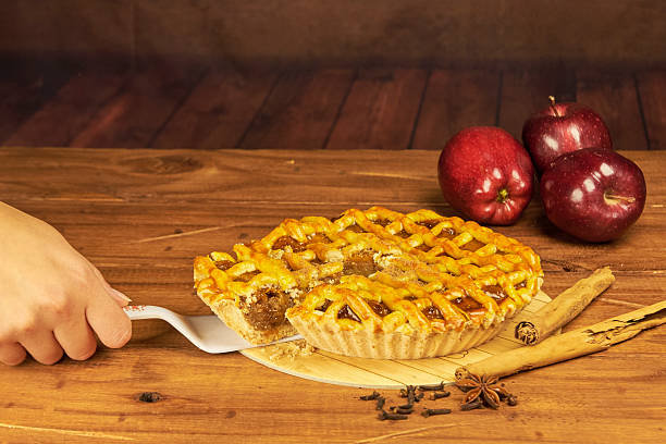 Apple pie in close-up on a rustic wooden background.