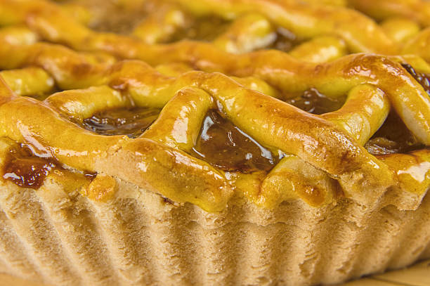 istock Apple pie in close-up on a rustic wooden background. 2240642754