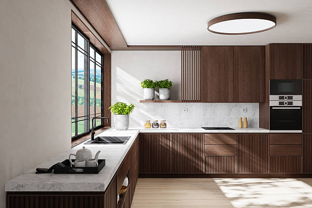 istock Modern Dual-Wall Kitchen with Dark Wood Cabinets and Marble Surfaces 2240643511