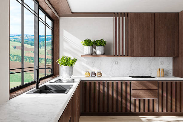 istock Modern Dual-Wall Kitchen with Dark Wood Cabinets and Marble Surfaces 2240643514