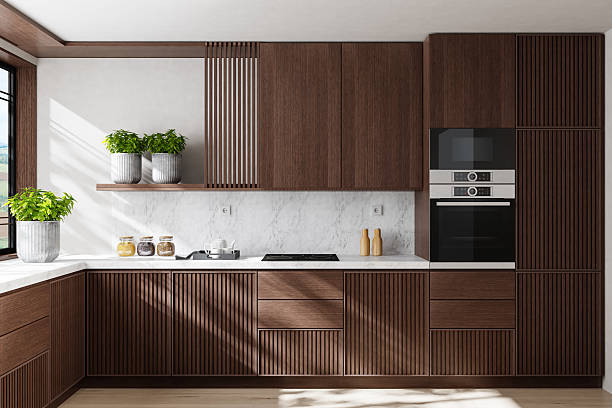 istock Modern Dual-Wall Kitchen with Dark Wood Cabinets and Marble Surfaces 2240643515