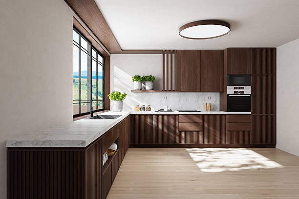 istock Modern Dual-Wall Kitchen with Dark Wood Cabinets and Marble Surfaces 2240643559