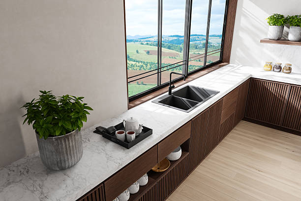 istock Modern Dual-Wall Kitchen with Dark Wood Cabinets and Marble Surfaces 2240643570