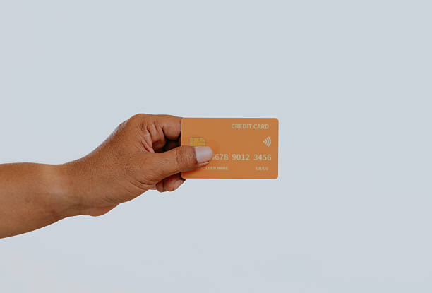 istock Hand holding a credit card. 2240648851