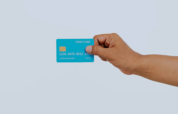 istock Hand holding a credit card. 2240648854