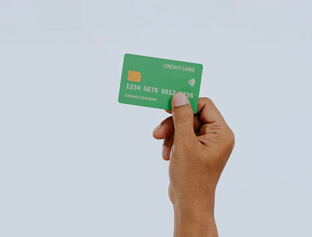 istock Hand holding a credit card. 2240648861