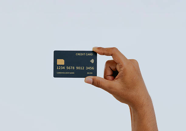 istock Hand holding a credit card. 2240648863