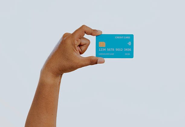 istock Hand holding a credit card. 2240648870