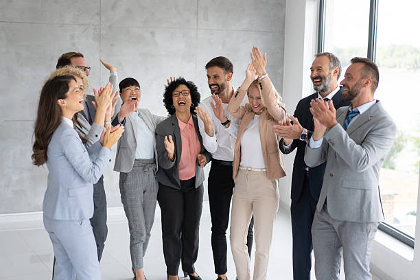 istock Excited team engaging in celebration of their success 2240661227
