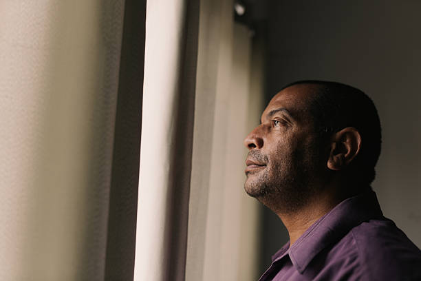 istock Profile portrait of black man in natural light 2240666523