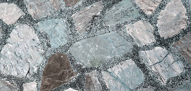 Decorative stone pavement with irregularly shaped natural rocks set in concrete.