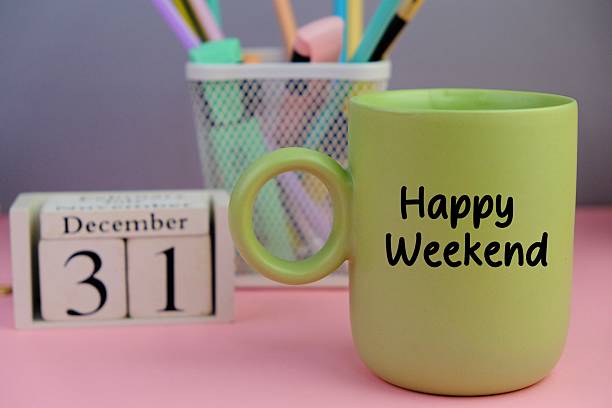 istock Happy Weekend - business concept with text on pink morning coffee or tea cup. horizontal image 2240673946