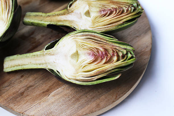 istock Freshly cut artichokes revealing layered texture. 2240675352