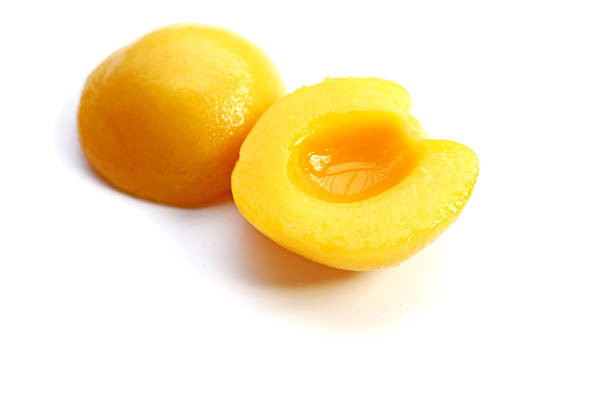istock Peach halves in syrup. Fruity desserts 2240676999