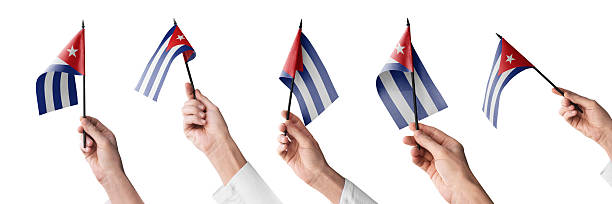 The Cuba flag in hand in different angles on a white background.