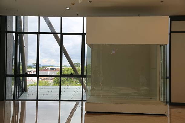 istock the large glass window in front, which has an empty wall inside with no furniture or artwork on it. tround. 2240681365