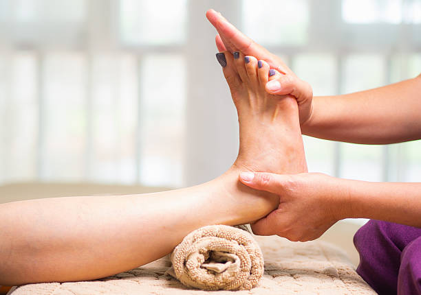 istock Foot reflexology massage for stress relief and balance. 2240682655