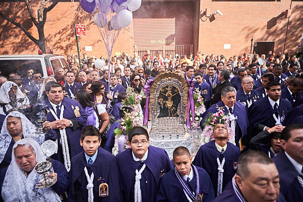 Amazonia, Ecuador - June 11, 2024: Group of indigenous faithful around a Catholic priest in the jungle