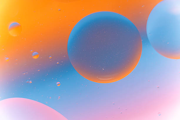 istock Orange and Tosca Pink Fluid Bubbles Abstract Background 2240687792