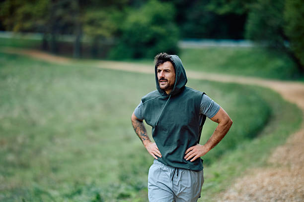 istock Tired man taking break after outdoor workout 2240688282