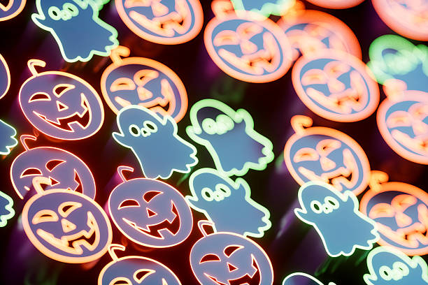 Halloween Pumpkin and Ghost Shapes with Neon Outlines. Digitally generated image. 3d render.