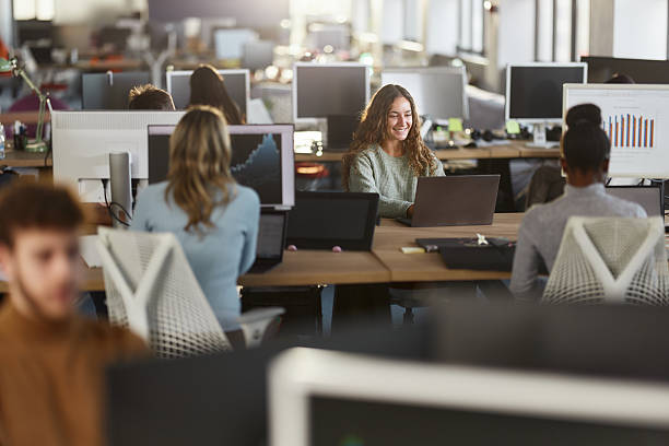 istock Happy female designer working on laptop in the office. 2240696268