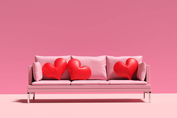 istock Pink sofa with red hearts showing love and affection 2240696386