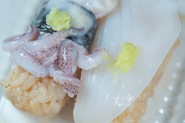 istock Macro shot of multiple squid nigiri sushi pieces with shallow focus. 2240697980