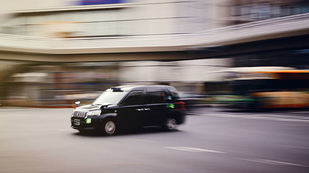 istock Motion Blurred Taxi in Tokyo Japan 2240702806