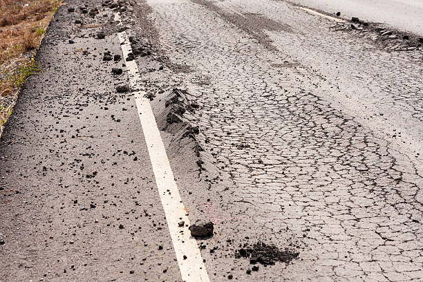 istock Road damage assessment eroded surface urban area documentation asphalt condition close-up view infrastructure 2240703048