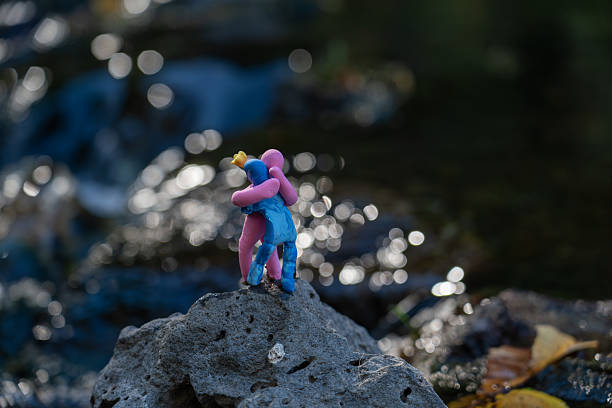 Colorful plasticine sculptures depicting human emotions and friendships in outdoor setting.