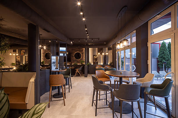 istock Modern stylish restaurant interior with plants, brick wall, and ambient lighting 2240703683