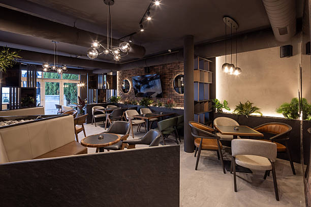 istock Contemporary restaurant design featuring brick walls, warm lighting, and comfortable seating area 2240703732