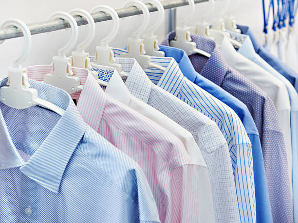 istock Mens shirts on hangers in a store 2240703834