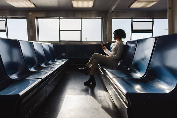 istock Woman sitting on public transit during early morning commute 2240704076