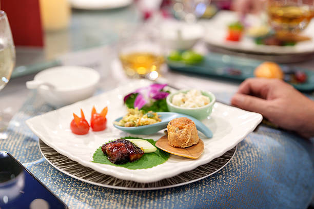 Assorted Chinese appetizers served on white ceramic plate