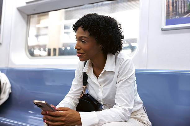 istock Woman commuting to work while sitting on morning train 2240704631