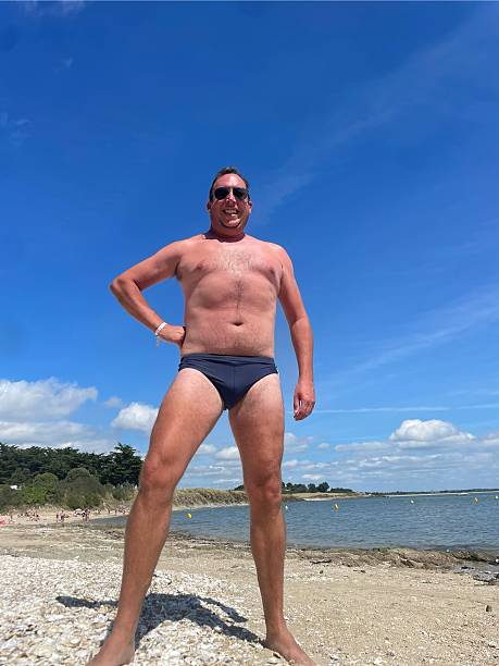istock A man stood on a beach in swimwear 2240708628