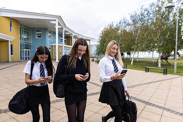 istock Girls Leaving School Together 2240708794