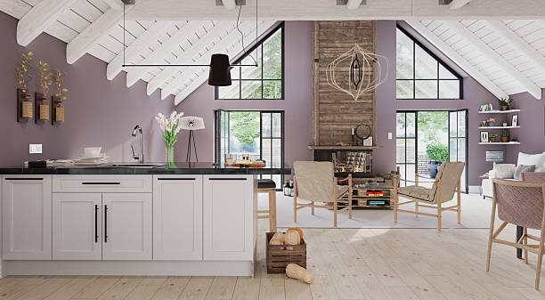 istock Modern open-plan interior with kitchen and living room. Rustic farmhouse design with a vaulted ceiling and fireplace. Scandinavian style home decor concept 2240710757